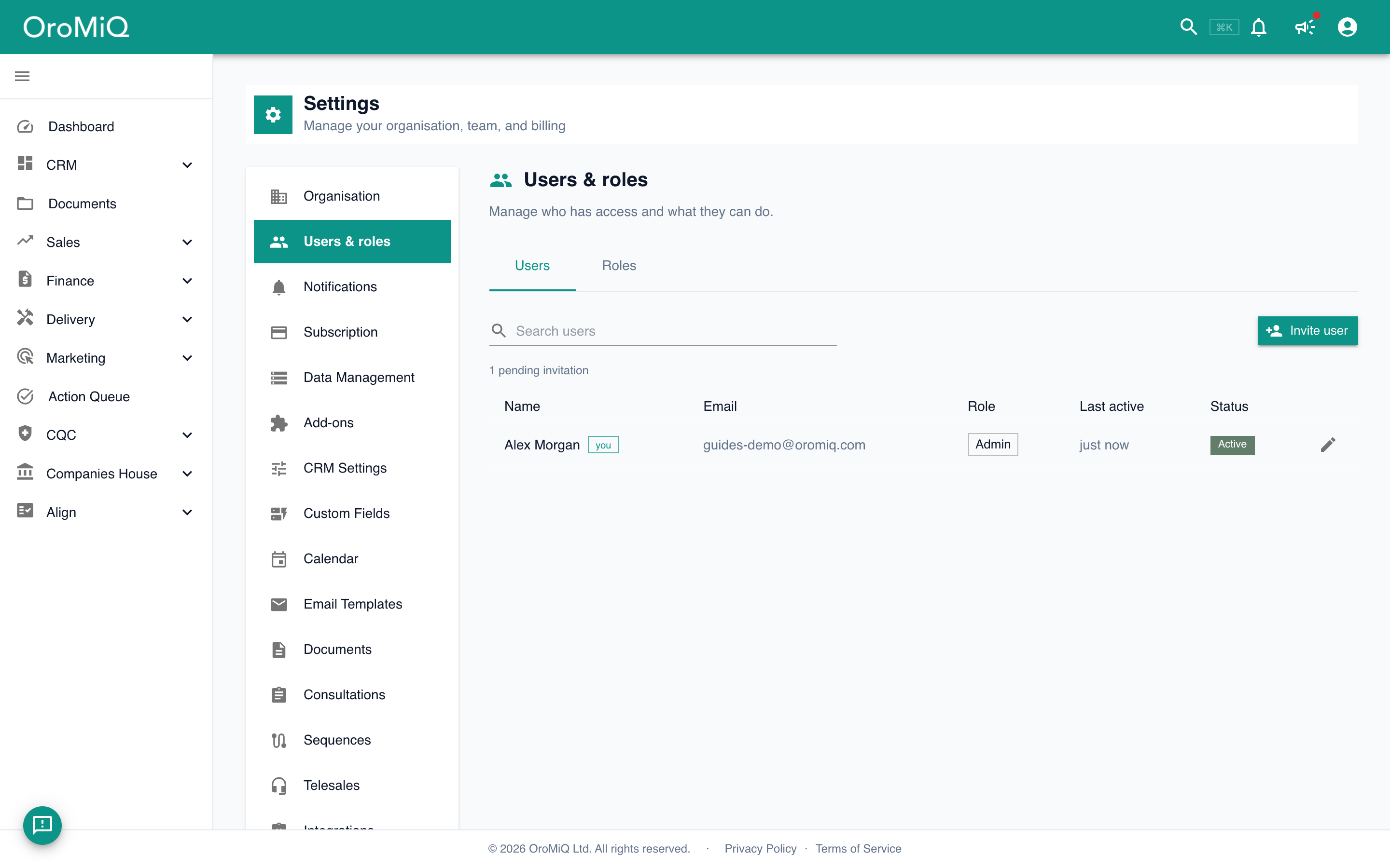 The Users tab under Users & roles, listing team members with their email, role, last active time and status.